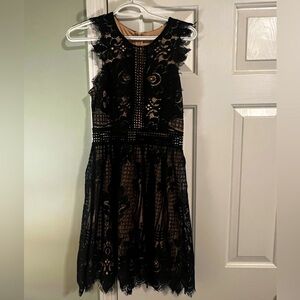 NEW WITH TAGS! Black dress with nude color lining.